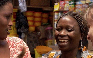 two African women with visitor