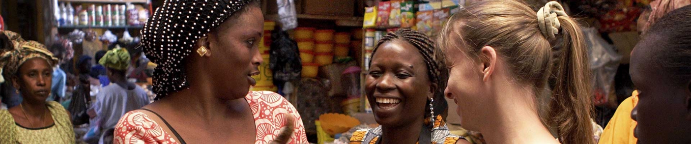 two African women with visitor