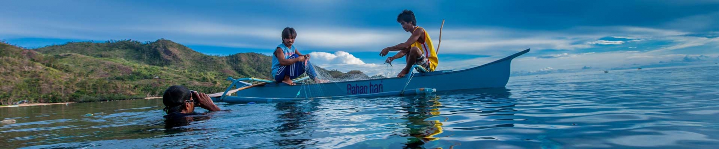 Two men fishing in canoe