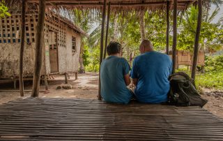 missionary and Filipino friend talking