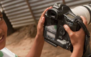 Colombian girl holding camera