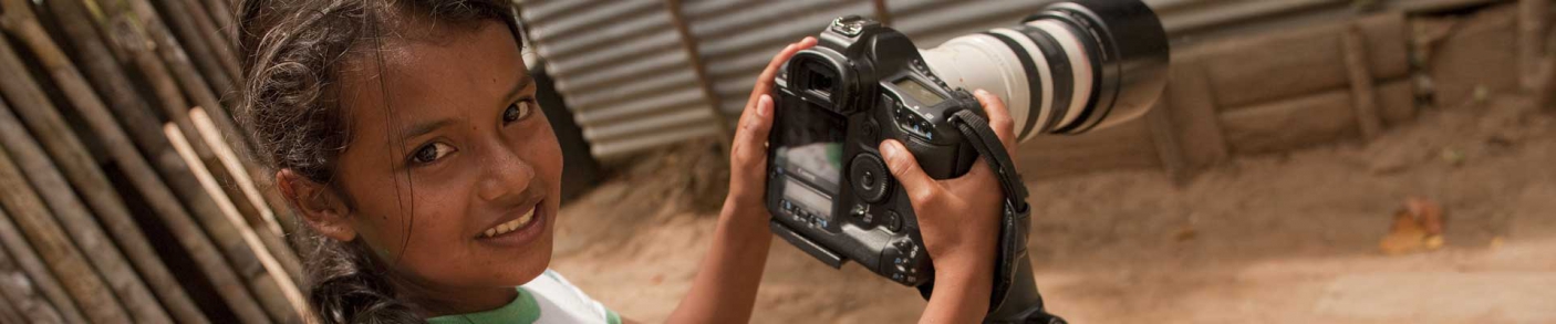 Colombian girl holding camera