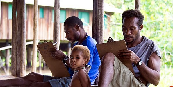 PNG men studying