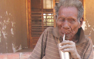 Manjui man drinking Terere