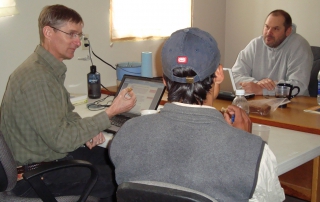 Kevin Case, left, works with translation expert Kevin Gutwein and a Tepehuan man.