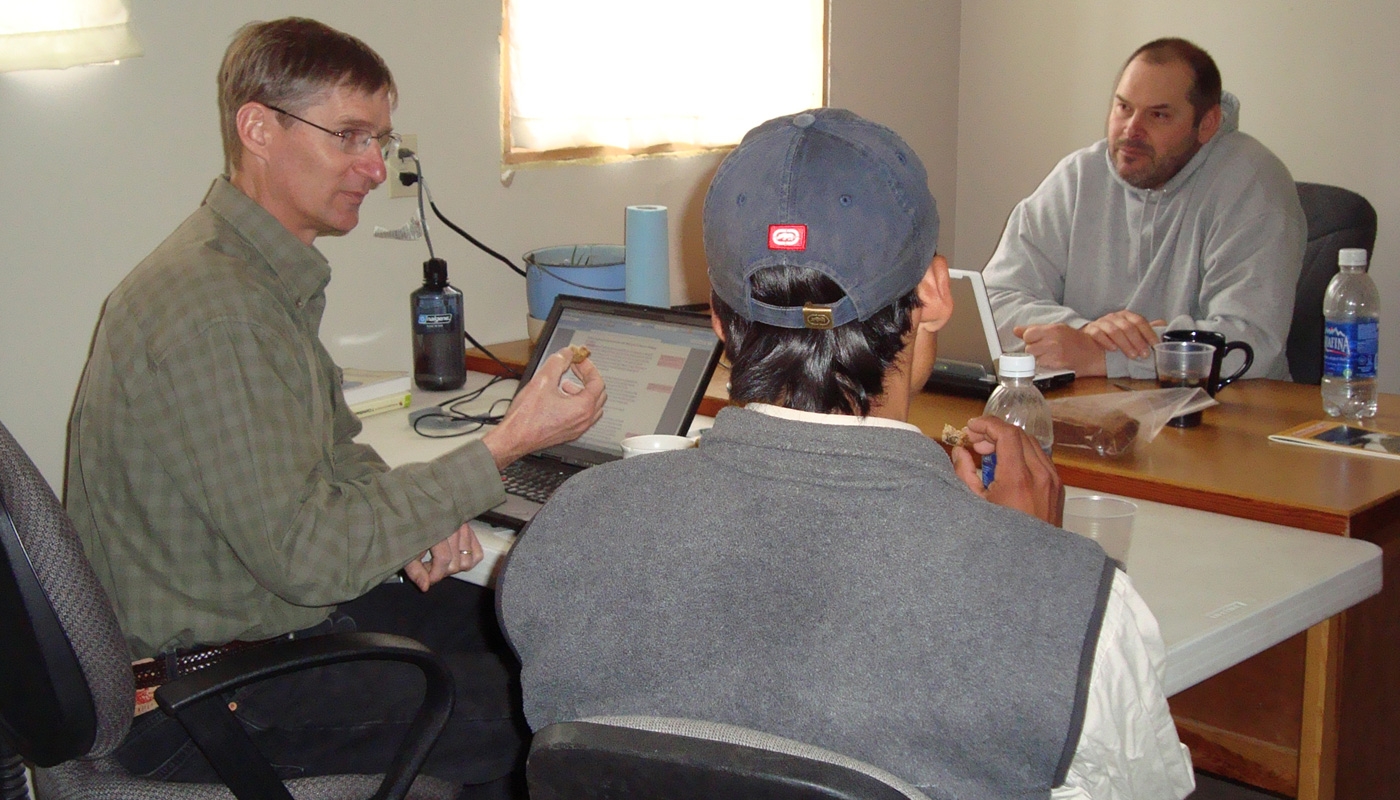 Kevin Case, left, works with translation expert Kevin Gutwein and a Tepehuan man.