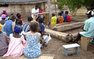 Budik teacher Pityan shares a Bible lesson with Budik believers.