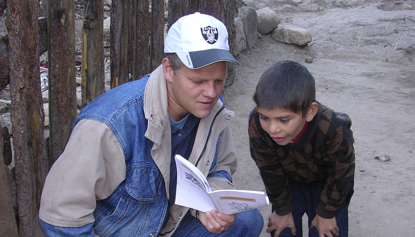 Young boy examines bible