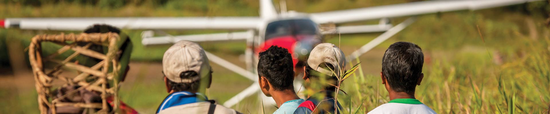 tribal men and plane