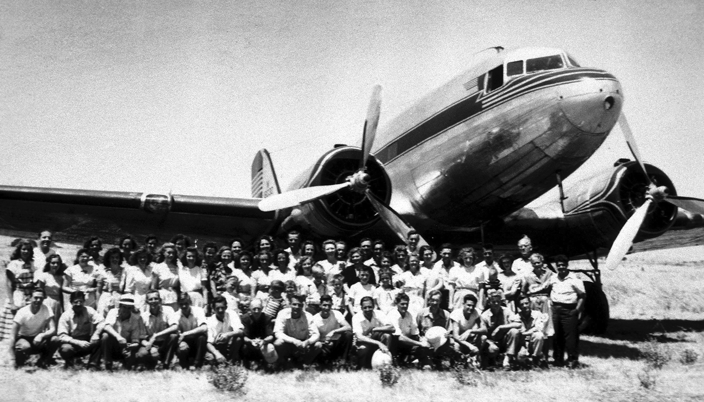 old plane with group of men