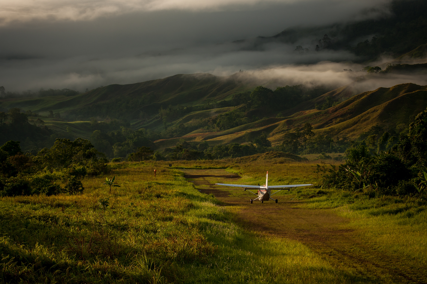 small plane on a mountainous runway