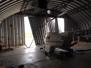 Airplane hangar damage from typhoon