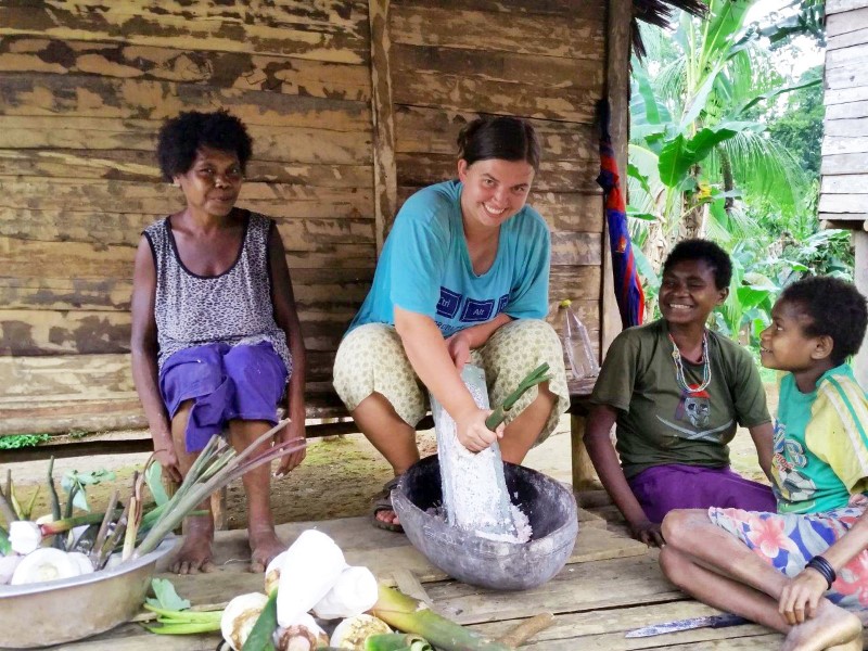 Rachel Van Der Decker helping prepare traditional food