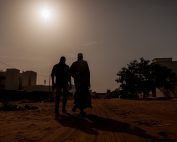 Silhouette of two men in Africa