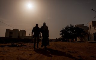 Silhouette of two men in Africa