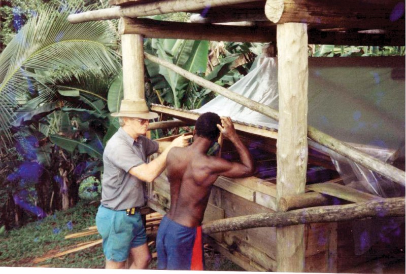 missionary standing with man from Papua New Guinea