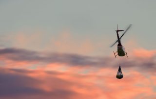 R66 helicopter hauling cargo with a sling load