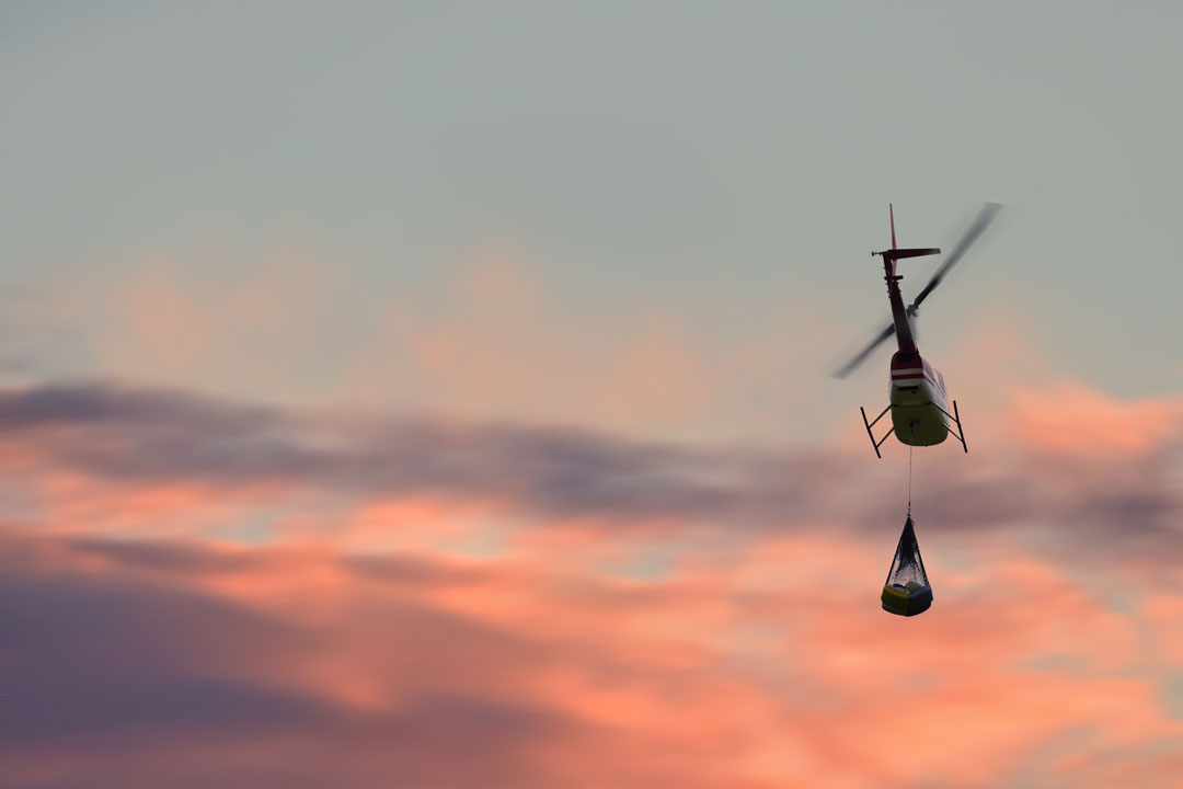 R66 helicopter hauling cargo with a sling load