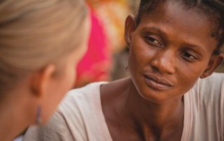 missionary woman and her friend speaking