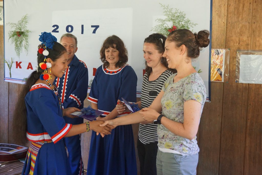 one of the first tala-andig graduates receives her diploma