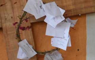 cross and crown of thorns with mock "certificates of death" visualize Jesus' sacrifice for us