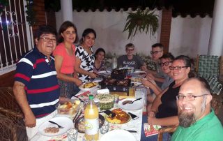 missionaries having a big meal with Paraguayan friends