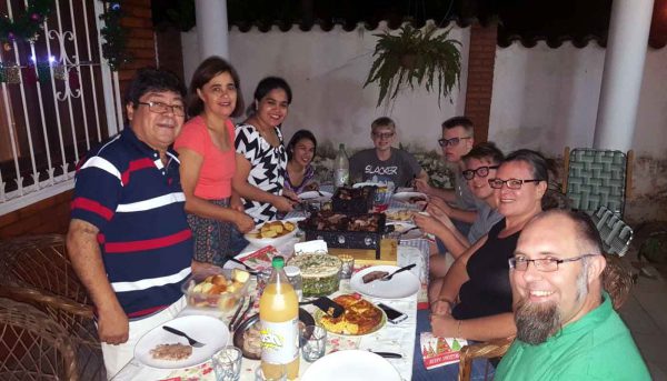 missionaries having a big meal with Paraguayan friends