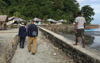 missionaries walking into a village on Kurudu