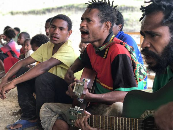 men from Papua New Guinea praising God