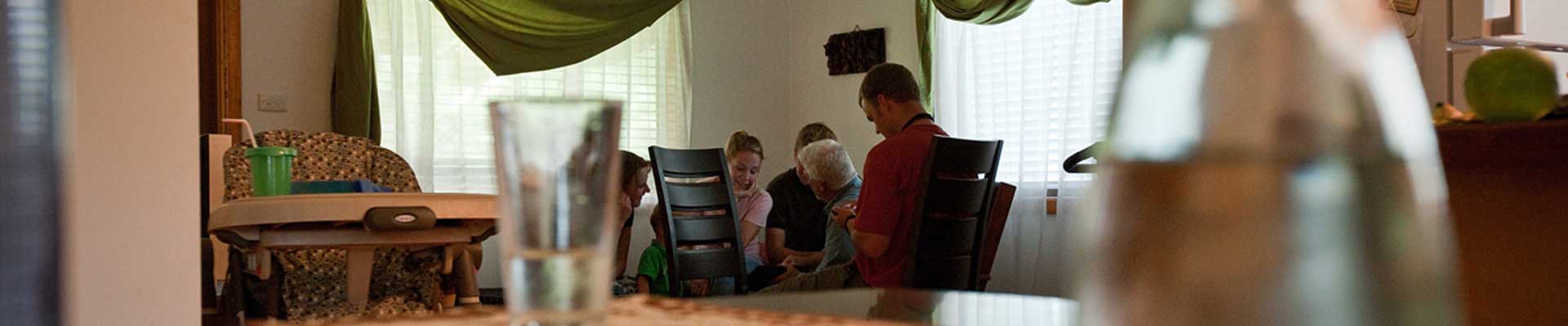 missionaries meeting in a house