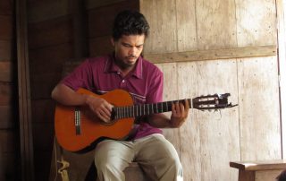 man playing a classical guitar