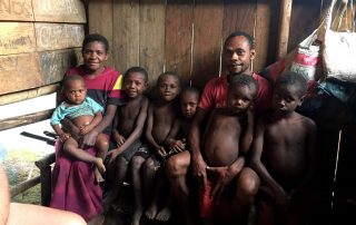 Mengen man with his wife and six children