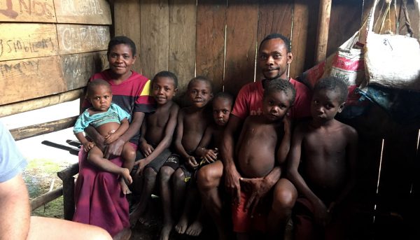 Mengen man with his wife and six children