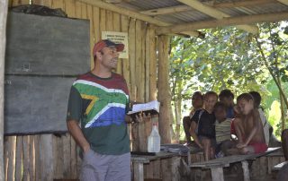 missionary teaching a Bible lesson in Papua New Guinea