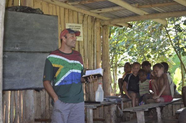 missionary teaching a Bible lesson in Papua New Guinea