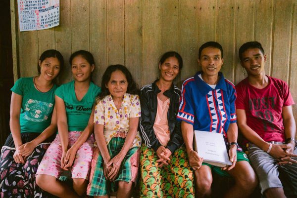 Filipino group sitting on a bench