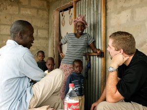 missionary chatting with neighbours in Africa