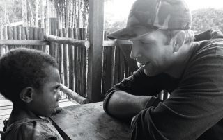 missionary talking to a young boy