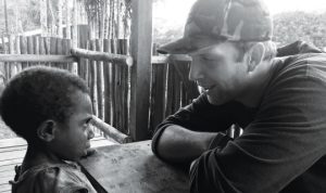 missionary talking to a young boy