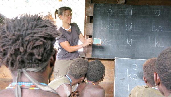 Moi people learning to read their language