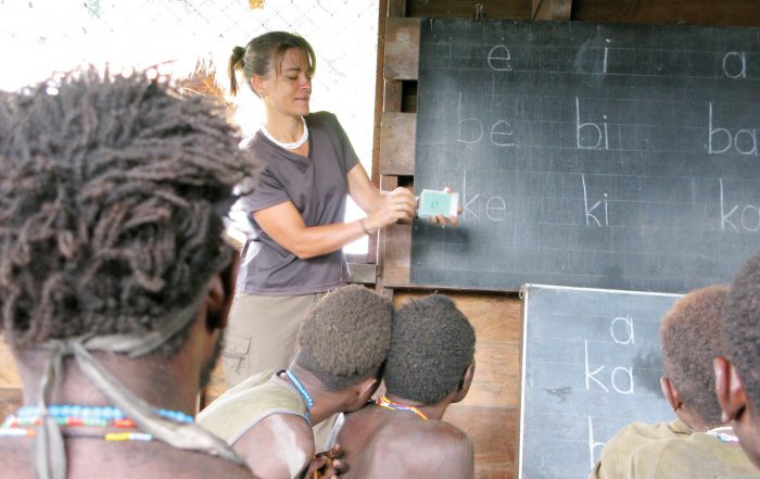 Moi people learning to read their language