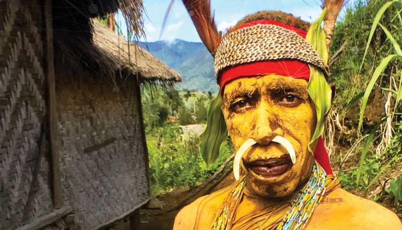 man in traditional garb and paint