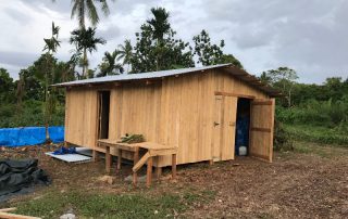 simple wooden shed to be used as a temporary house for a missionary