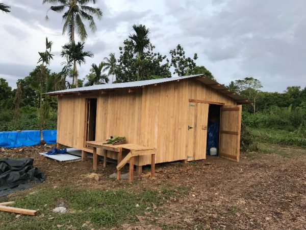 simple wooden shed to be used as a temporary house for a missionary