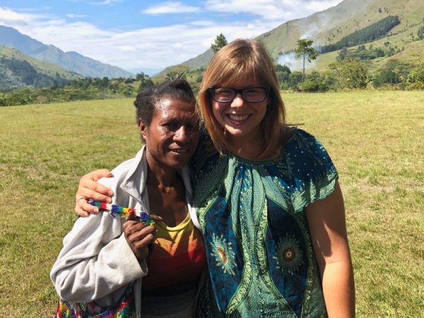 missionary woman standing on the airstrip with a Menyan woman