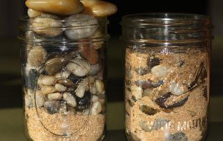 jars full of rocks and sand