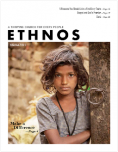 June 2019 Ethnos Magazine cover - tribal girl standing by a tree trunk