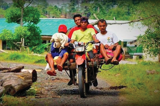 Filipino motorcycle taxi with 3 passangers