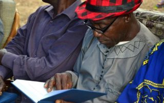 man reading book at an event