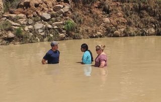 two missionaries are baptizing a Nahuatl believer